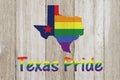 A rustic old Texas pride flag with state map on weathered wood Royalty Free Stock Photo