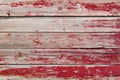 Rustic old weathered wood plank background with flaking red paint