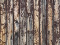 Rustic old weathered wood plank background with flaking brown paint