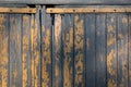 Rustic old worn door background wooden yellow painted Royalty Free Stock Photo