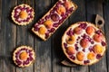 Rustic open pie with peach and raspberry, french galette . Peach tart. Raspberry tart. Tartalette with cream. Variety of bakery. Royalty Free Stock Photo