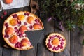 Rustic open pie with peach and raspberry, french galette . Peach tart. Raspberry tart. Tartalette with cream. Variety of bakery.