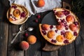 Rustic open pie with peach and raspberry, french galette . Peach tart. Raspberry tart. Tartalette with cream. Variety of bakery. Royalty Free Stock Photo