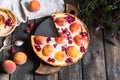 Rustic open pie with peach and raspberry, french galette . Peach tart. Raspberry tart. Tartalette with cream. Variety of bakery. Royalty Free Stock Photo