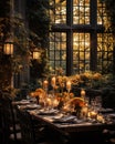 Rustic outdoor table setting with candles, vase of flowers and yellow leaves for a warm and inviting feel