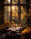 Rustic outdoor table setting with candles, vase of flowers and yellow leaves for a warm and inviting feel Royalty Free Stock Photo