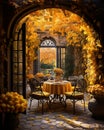 Rustic outdoor table setting with candles, vase of flowers and yellow leaves for a warm and inviting feel Royalty Free Stock Photo