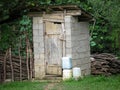 Rustic outdoor toilet stands in the garden Royalty Free Stock Photo