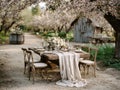 Rustic Outdoor Wedding Table Setting Under Peach Blossoms Royalty Free Stock Photo