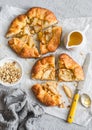 Rustic pear pie with honey and walnuts on grey background Royalty Free Stock Photo