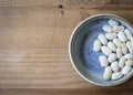 Pretty blues with rustic wood and white beans for contrast Royalty Free Stock Photo