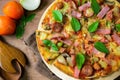 Rustic pizza with becon, salami, mozzarella and basil Royalty Free Stock Photo