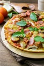 Rustic pizza with becon, salami, mozzarella and basil Royalty Free Stock Photo