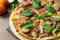 Rustic pizza with becon, salami, mozzarella and basil Royalty Free Stock Photo