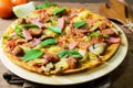 Rustic pizza with becon, salami, mozzarella and basil Royalty Free Stock Photo