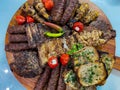 Rustic platter prepared for tourists with small, pork ribs with toast spread with lard