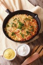 Rustic Potato pancakes with herbs close-up in a frying pan. vert Royalty Free Stock Photo