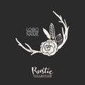 Rustic premade typographic logo with flowers, branches, antlers and feathers.