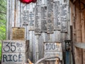 Rustic ranch setting with several signs depicting cattle hung on a wall