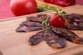 Rustic raw smoked meat sliced on chopping board Royalty Free Stock Photo