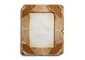 A rustic rectangular photo frame made from weathered brown cardboard edges isolated on a clean white studio background surface Royalty Free Stock Photo