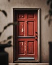 Rustic Red Back Door with Weatherstripping for Effective Insulation and Energy Efficiency. Royalty Free Stock Photo