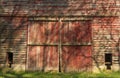 Rustic red barn doors. Royalty Free Stock Photo