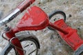 Rustic Red Tricycle Covered in Ice - Closeup