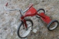 Rustic Red Tricycle Covered in Ice