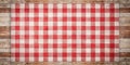 Rustic red and white checkered cloth on weathered wood background. Generative AI Royalty Free Stock Photo