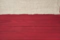 Rustic Red Wood Boards in Flat layout with off white Burlap fabric on top side as decorative design element. It`s horizontal but