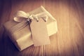 Rustic retro gift, present box with tag. Christmas time, eco paper wrap.