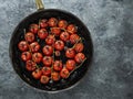 Rustic roasted red summer cherry tomato Royalty Free Stock Photo