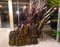 Rustic rock throne of oxidized iron electric guitars among the display cases