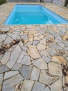 Rustic, rough and dirty stone pool floor, .