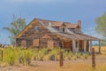 A rustic, rundown, old abandoned, ruined, farm house in the countryside of a prairie in Colorado