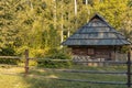 Rustic rural wooden cabin village house Ukraine country side scenic nature environment sun light on foliage Royalty Free Stock Photo