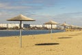 Rustic scenic view of Ukrainian small city Khmelnytskyi beach umbrellas waterfront river in common day time and lonely walking