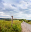 Rustic signpost pointing to Ditchling Beacon