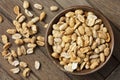 Rustic spicy dry roasted peanuts detail from above. Royalty Free Stock Photo