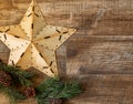 Rustic star and pine branch on wood background, perfect for country Christmas