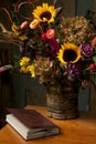 Rustic still life with autumn flowers and book