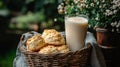 A Rustic Still Life with Biscuits, Milk, and Flowers Royalty Free Stock Photo