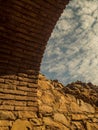 Rustic Stone Archway with Cloudy Sky