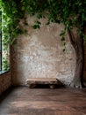 Rustic stone bench in a room with a tree and vines. Royalty Free Stock Photo