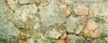 Rustic stone cladding, with a diverse array of shapes and a palette of earthy tones creating a natural textured surface. Royalty Free Stock Photo