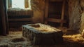 Rustic stone manger in sunlit stable with straw bedding Royalty Free Stock Photo