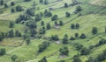 Rustic stone shepherds cabins on green meadows Royalty Free Stock Photo