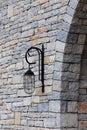 Rustic stone wall with metal lantern Royalty Free Stock Photo