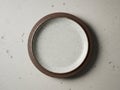 Rustic stoneware plate, round, with brown rim, speckled surface Royalty Free Stock Photo